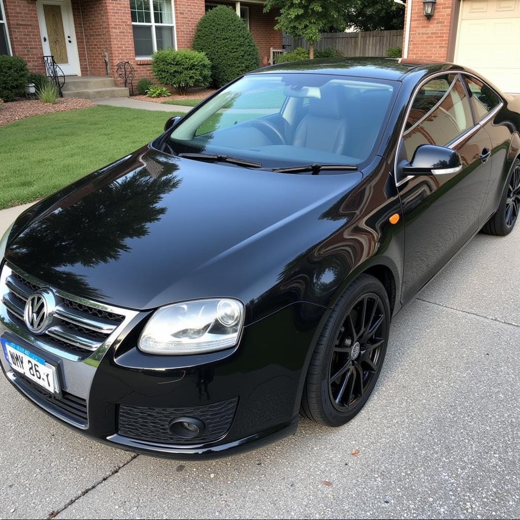 A freshly detailed car parked in a driveway