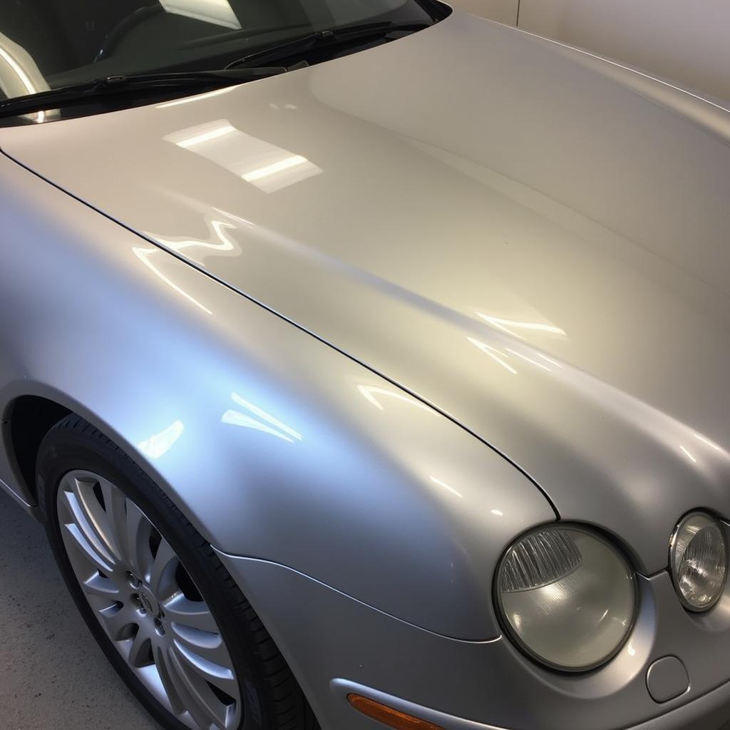 A finished detailed silver car shining brightly