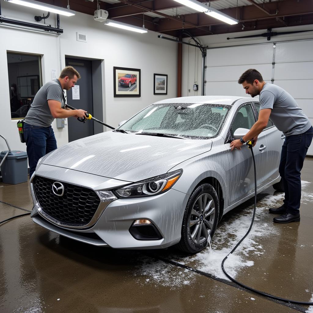 Exterior car wash at a Boston detailing shop