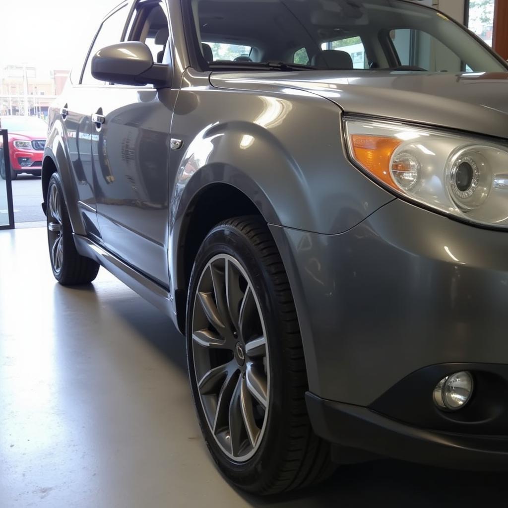 A gleaming car exterior after a full detail showcasing a deep gloss and flawless finish.