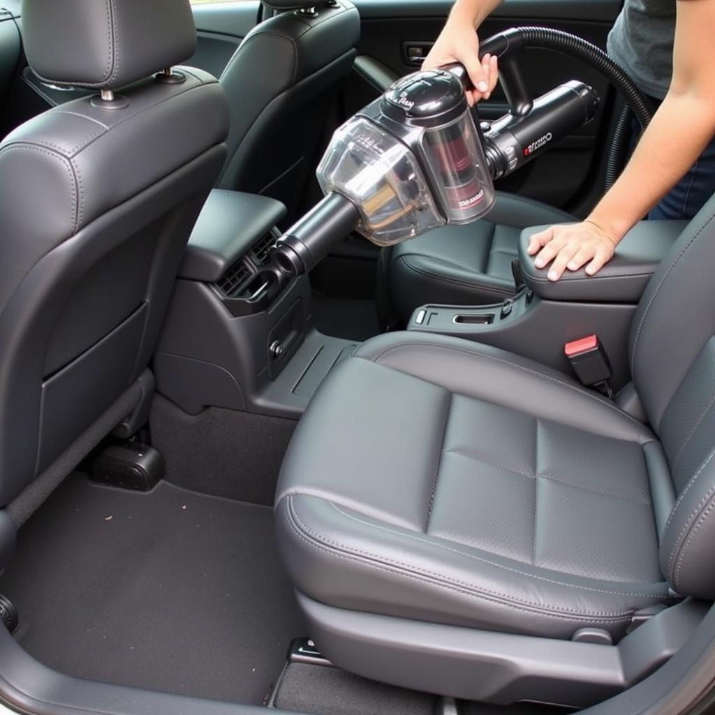 Car interior vacuuming during the detailing process