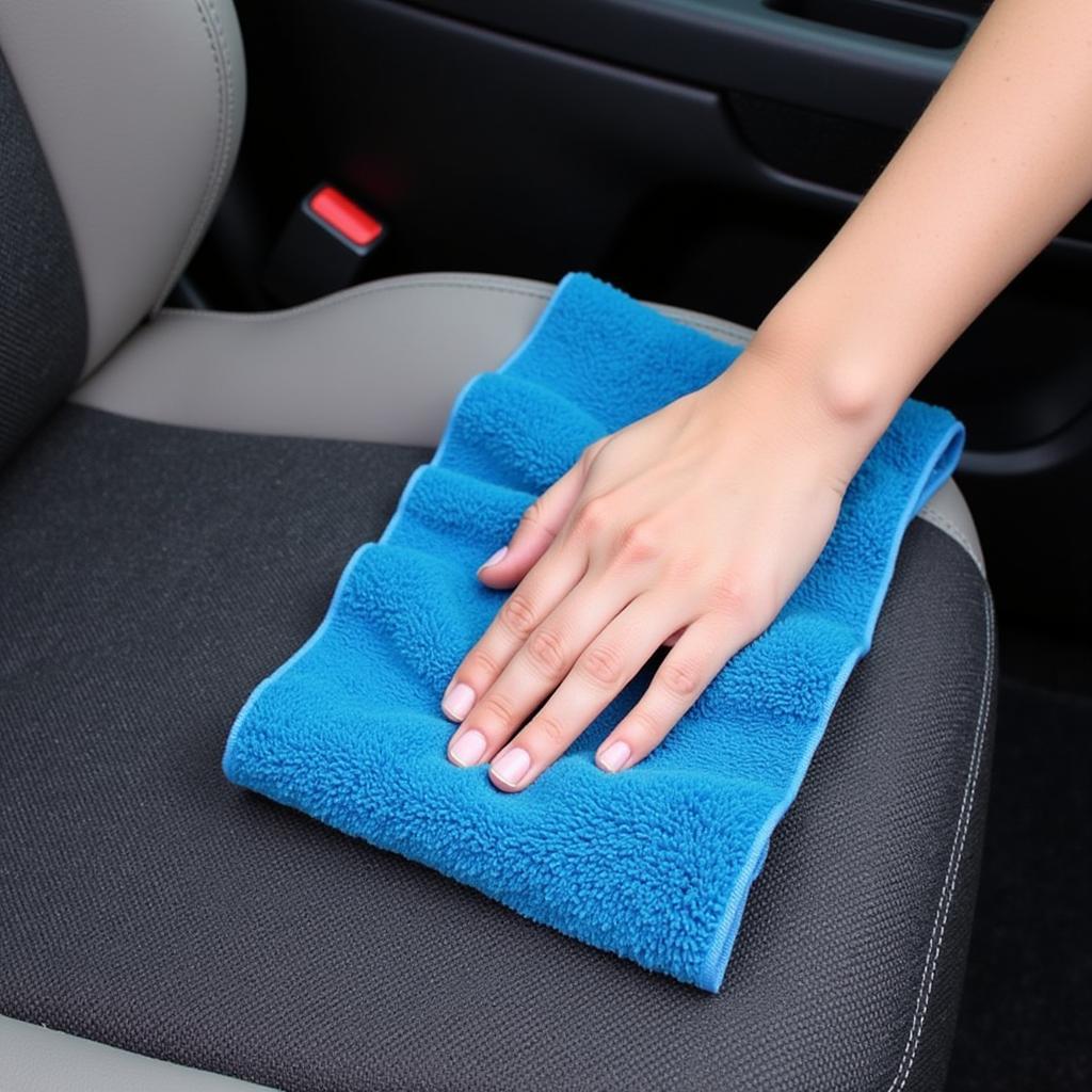 Drying Heated Car Seats with Microfiber Towel