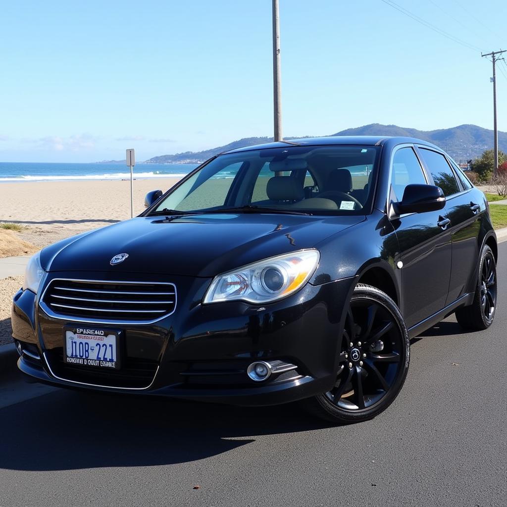 A freshly detailed car parked in Manhattan Beach with the ocean in the background.