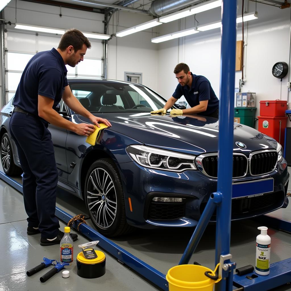 A car undergoing a full detailing service, including washing, waxing, and interior cleaning.