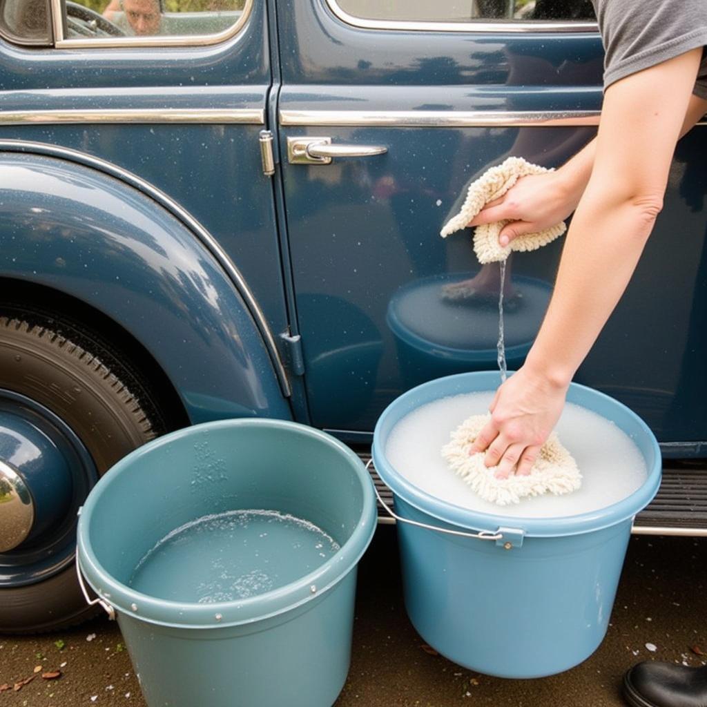 Hand washing an antique car using the two-bucket method