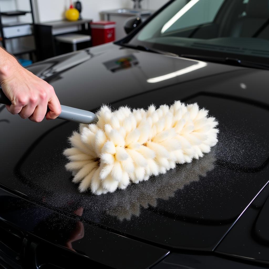 Lambswool duster cleaning a car