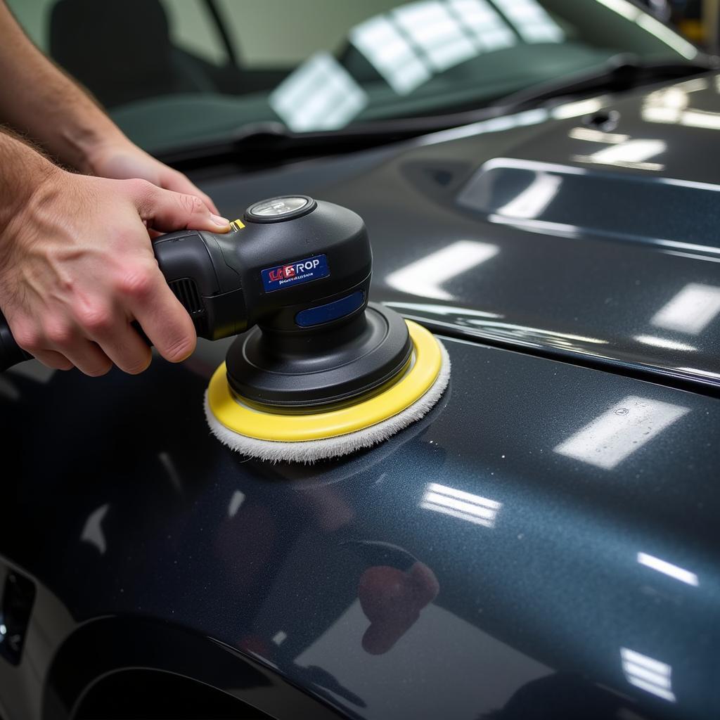 Polishing a car with a machine polisher to remove swirl marks