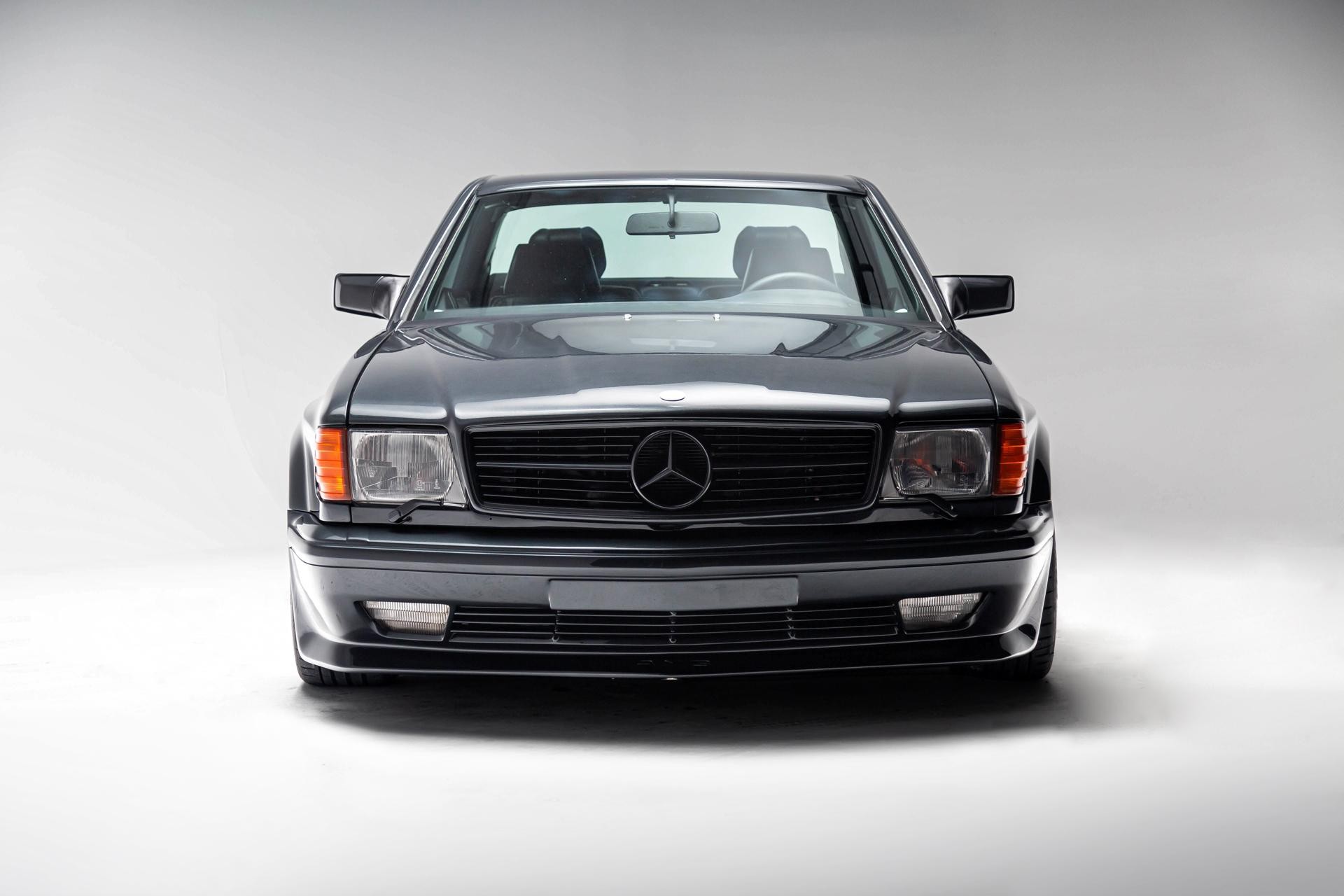 Blue-Black Metallic 1989 Mercedes-Benz 560SEC AMG Widebody Coupe Front Angle