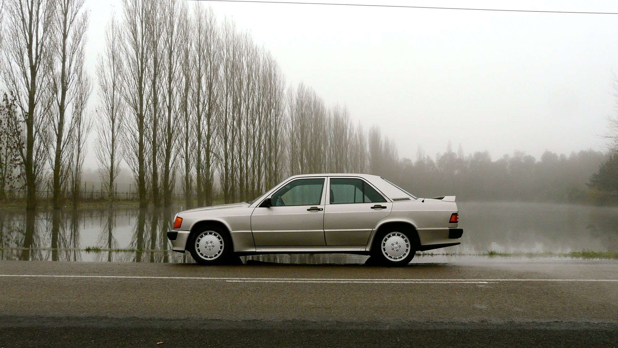 Vintage Mercedes-Benz W201 models in a garage