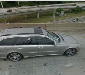 Silver 2007 Mercedes E63 AMG Wagon parked showcasing its rear profile and spacious cargo area, highlighting its blend of performance and practicality