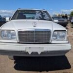 Exterior of a 1994 Mercedes-Benz E 320 wagon in remarkably clean condition at a Mercedes Benz salvage yard, showcasing the potential for finding high-quality used parts.