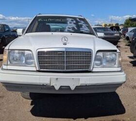 Exterior of a 1994 Mercedes-Benz E 320 wagon in remarkably clean condition at a Mercedes Benz salvage yard, showcasing the potential for finding high-quality used parts.