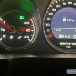 W204 Mercedes C63 fuel gauge showing low fuel and range