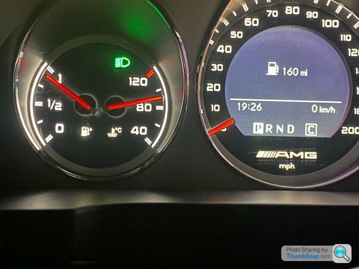 W204 Mercedes C63 fuel gauge showing low fuel and range