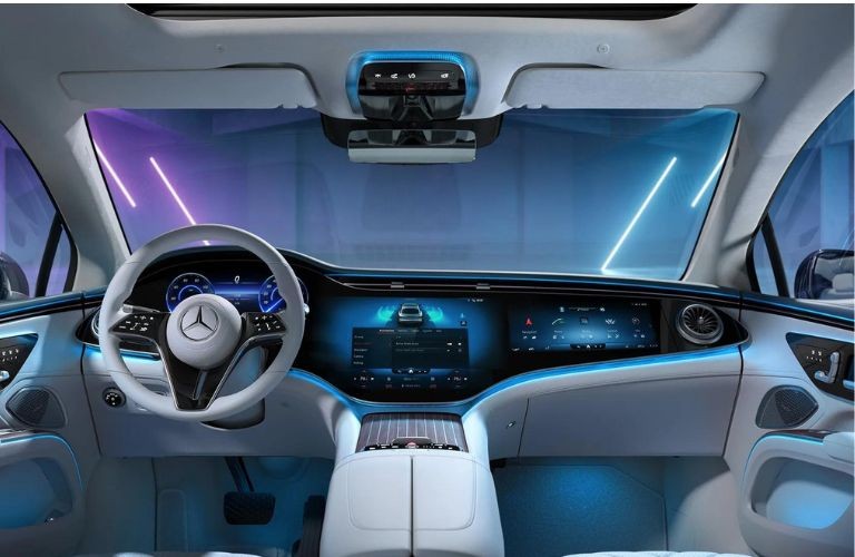 Mercedes-Benz dashboard illuminated with blue ambient lighting, showcasing the elegant interior.