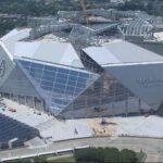 Mercedes-Benz Stadium Atlanta: Discover who owns this iconic venue and explore its state-of-the-art retractable roof and fan plaza.