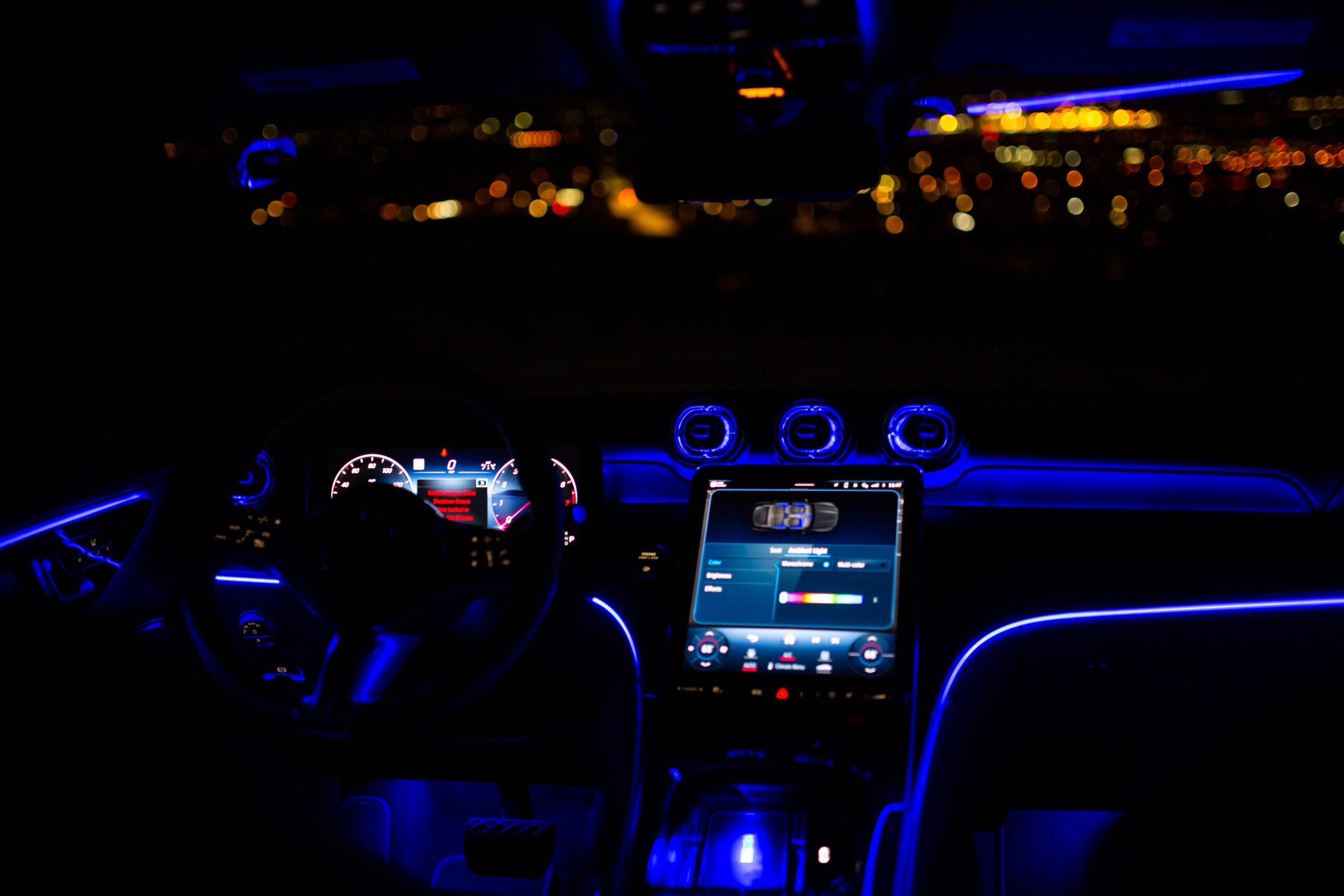 Mercedes GLC 300 detail of the door panel with integrated controls and ambient lighting accents