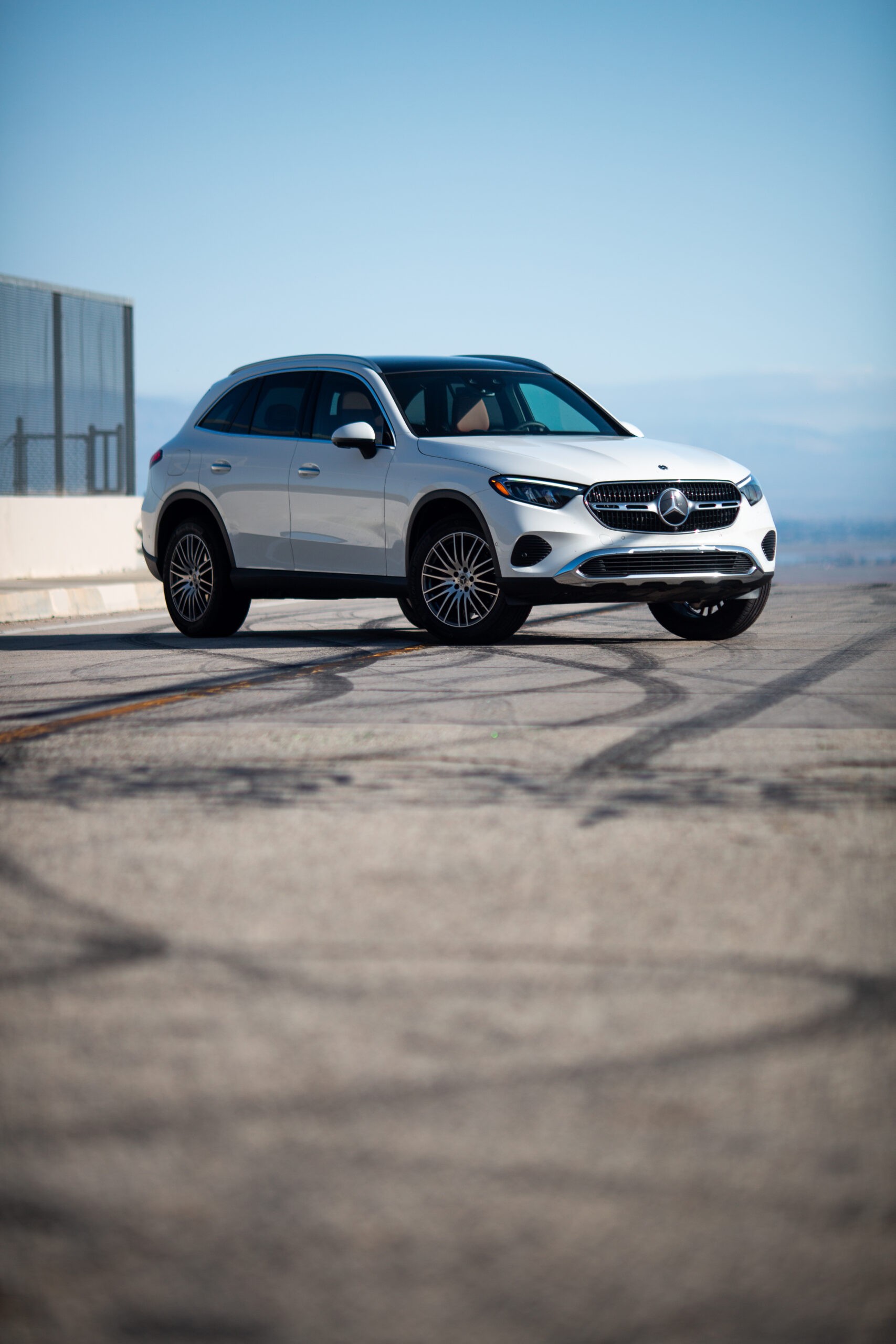 Mercedes GLC 300 exterior rear quarter view highlighting its sleek taillights and overall SUV profile