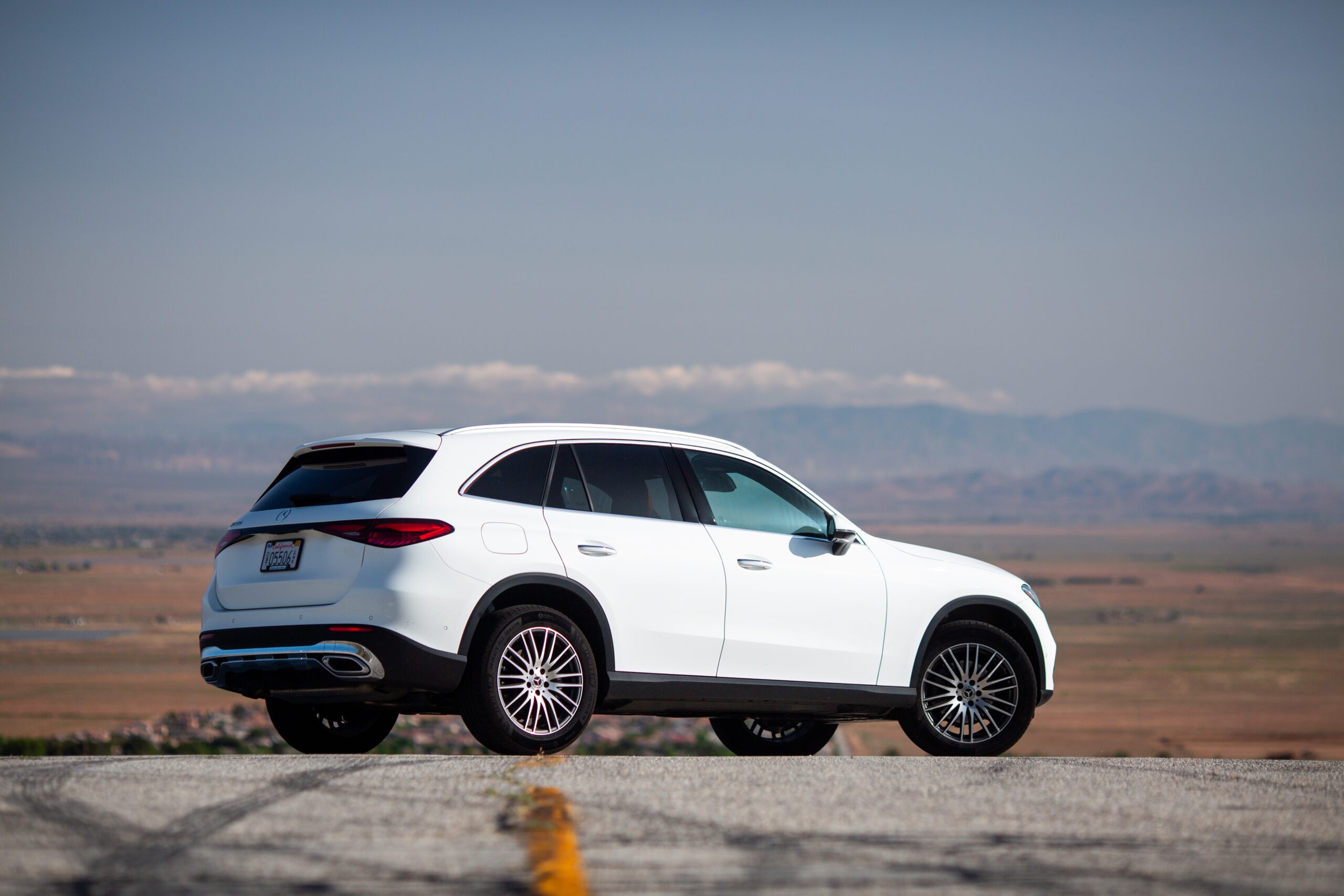 Mercedes GLC 300 front view parked on a scenic overlook representing its blend of luxury and practicality