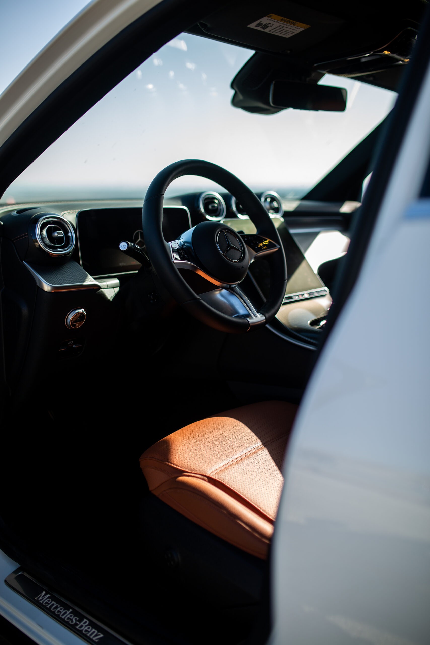 Mercedes GLC 300 driving through a scenic landscape emphasizing its comfortable touring capabilities