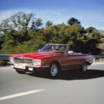 Classic Mercedes-Benz R107 SL in motion on a scenic road