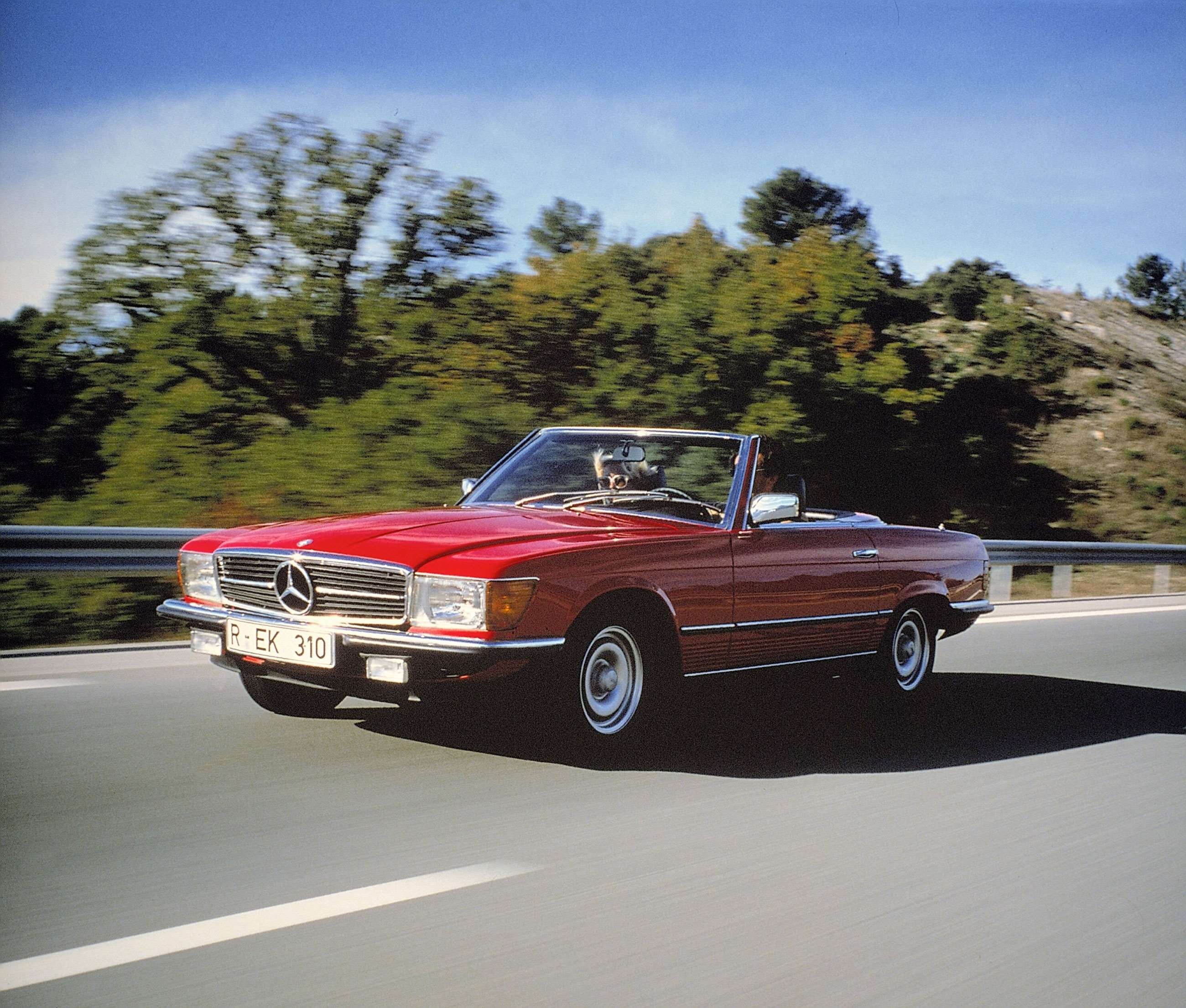 Classic Mercedes-Benz R107 SL in motion on a scenic road