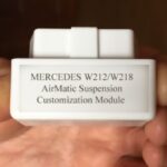 Compact OBD lowering module made in Germany, easily connects to Mercedes OBDII port