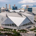 Mercedes-Benz Stadium interior view showcasing seating and the halo video board