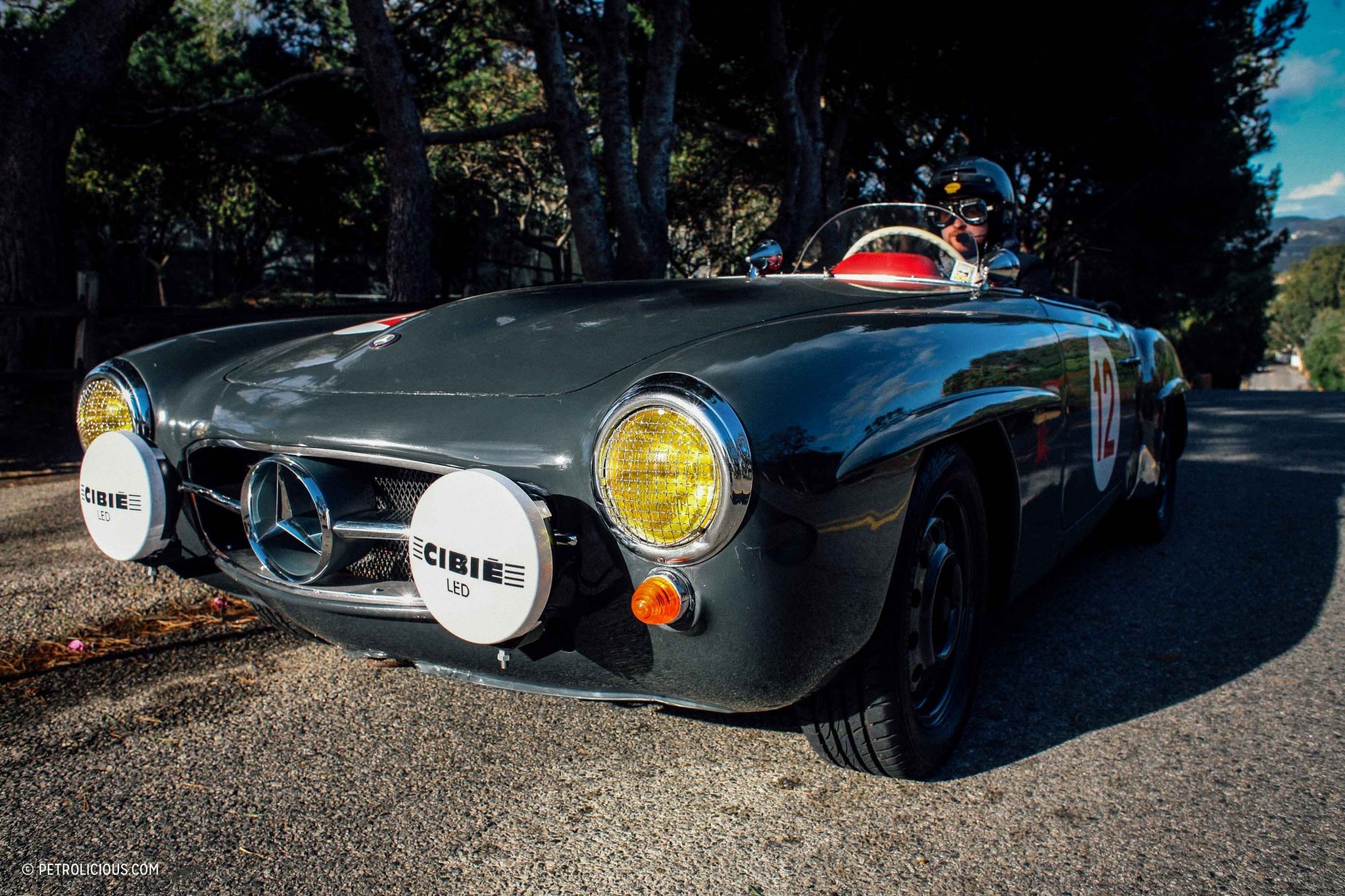 Front view of the Dolphin Grey 190SL Mercedes barn find, covered in dust but hinting at classic beauty.