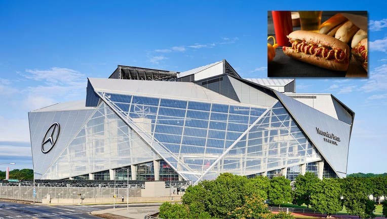 A wide shot of a busy concession stand at Mercedes-Benz Stadium, showing various food options and digital menu boards, highlighting the variety and value for fans.