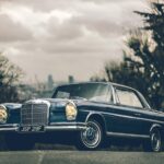 Mercedes-Benz W111 Coupe in Hampstead, London, showcasing its elegant side profile and Webasto sunroof