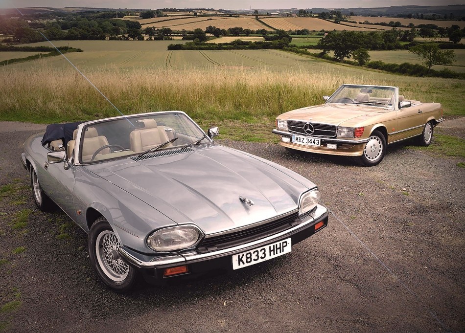 Classic Mercedes SL R107 and Jaguar XJS side by side, symbolizing different automotive philosophies of the 80s